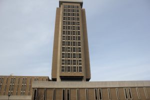 Van Hise Hall at UW Madison. Vertically large rectangular concrete tower with window rising up from a rectangular concrete building